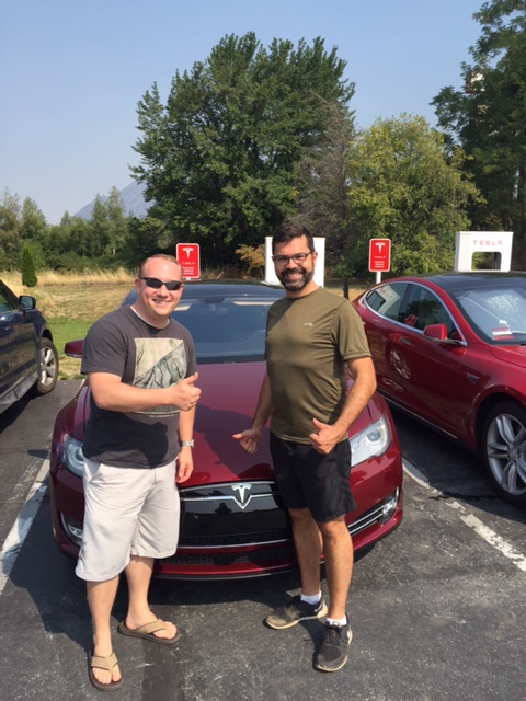 Jerome Guillen poses with Tesla owner at Mt Shasta Supercharger