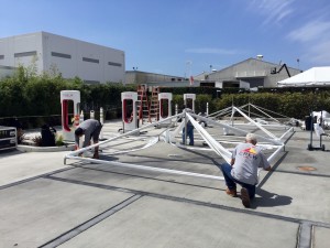 Tesla staff setting up tents for the Model 3 event