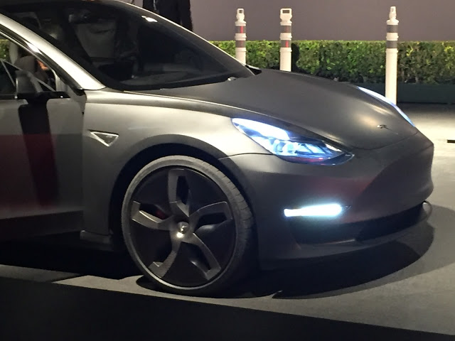 Matte Black Tesla Model 3 with low profile tires