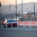 Red Tesla Model 3 at the Fremont Factory test track [Credit: Tesla Owners Club BE]