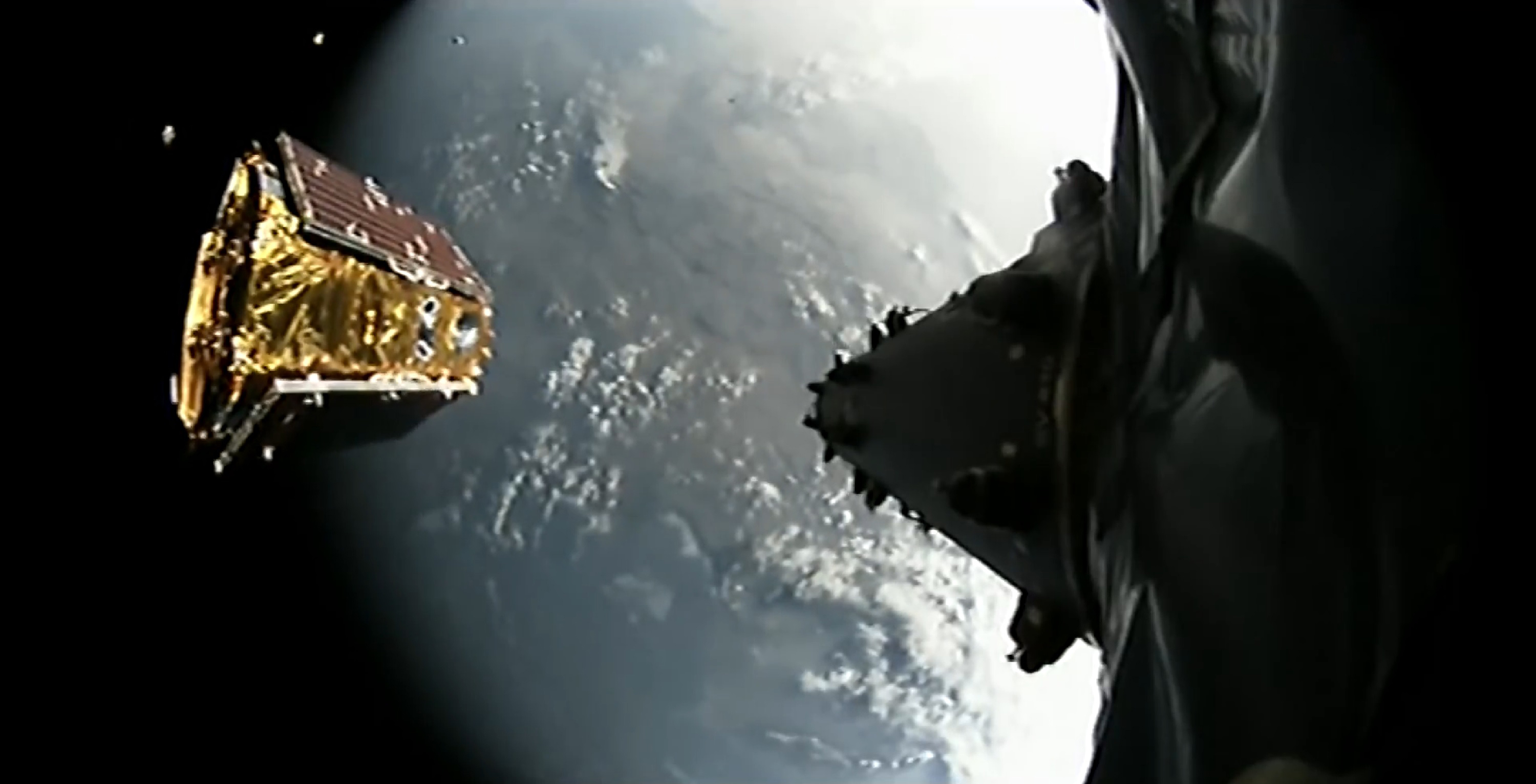 A truly picturesque live view of the Iridium NEXT Mission 3 satellite deployment. Four sats are visible in an arc on the left. Starlink will be denser and smaller, but will deploy similarly. (SpaceX)