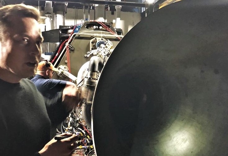 Elon Musk stands beside Raptor's nozzle as SpaceX propulsion prepares for its first hot-fire test. (Elon Musk)