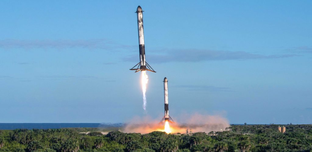 USAF photographer James Rainier's remote camera captured this spectacular view of Falcon Heavy Block 5 side boosters B1052 and B1053 returning to SpaceX Landing Zones 1 and 2. (USAF - James Rainier)