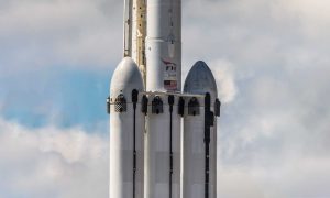 Falcon Heavy Flight 2. The booster in the middle - B1055 - was effectively sheared in half after tipping over aboard drone ship OCISLY. (Pauline Acalin)