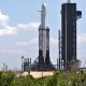 Falcon Heavy Flight 3 made use of both flight-proven side boosters and a new center core. Note the scorched landing legs and sooty exteriors. (SpaceX)