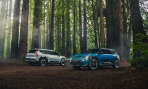 kia ev9 suvs in the woods